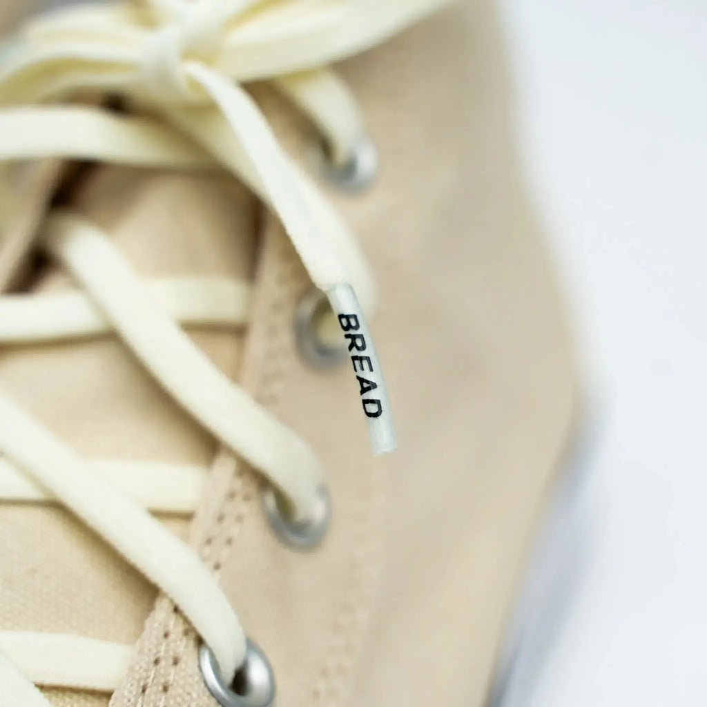 Elastic shoelaces from Plush Fashion Hub's Luxe Creme collection, featuring a soft, bread-colored design.