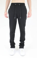Multi-color stacked sweatpants by Plush Fashion Hub featuring vibrant, layered fabric design and comfortable fit.