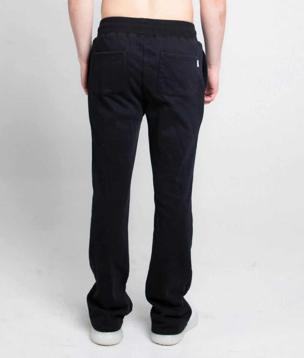 Multi-color stacked sweatpants from Plush Fashion Hub, showing relaxed fit with vibrant color blocks and elastic waistband.