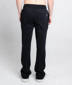 Multi-color stacked sweatpants from Plush Fashion Hub, showing relaxed fit with vibrant color blocks and elastic waistband.