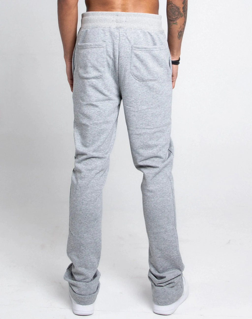 Multi-color stacked sweatpants by Plush Fashion Hub, featuring a relaxed fit and vibrant design, shown on a model.