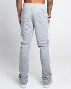 Multi-color stacked sweatpants by Plush Fashion Hub, featuring a relaxed fit and vibrant design, shown on a model.