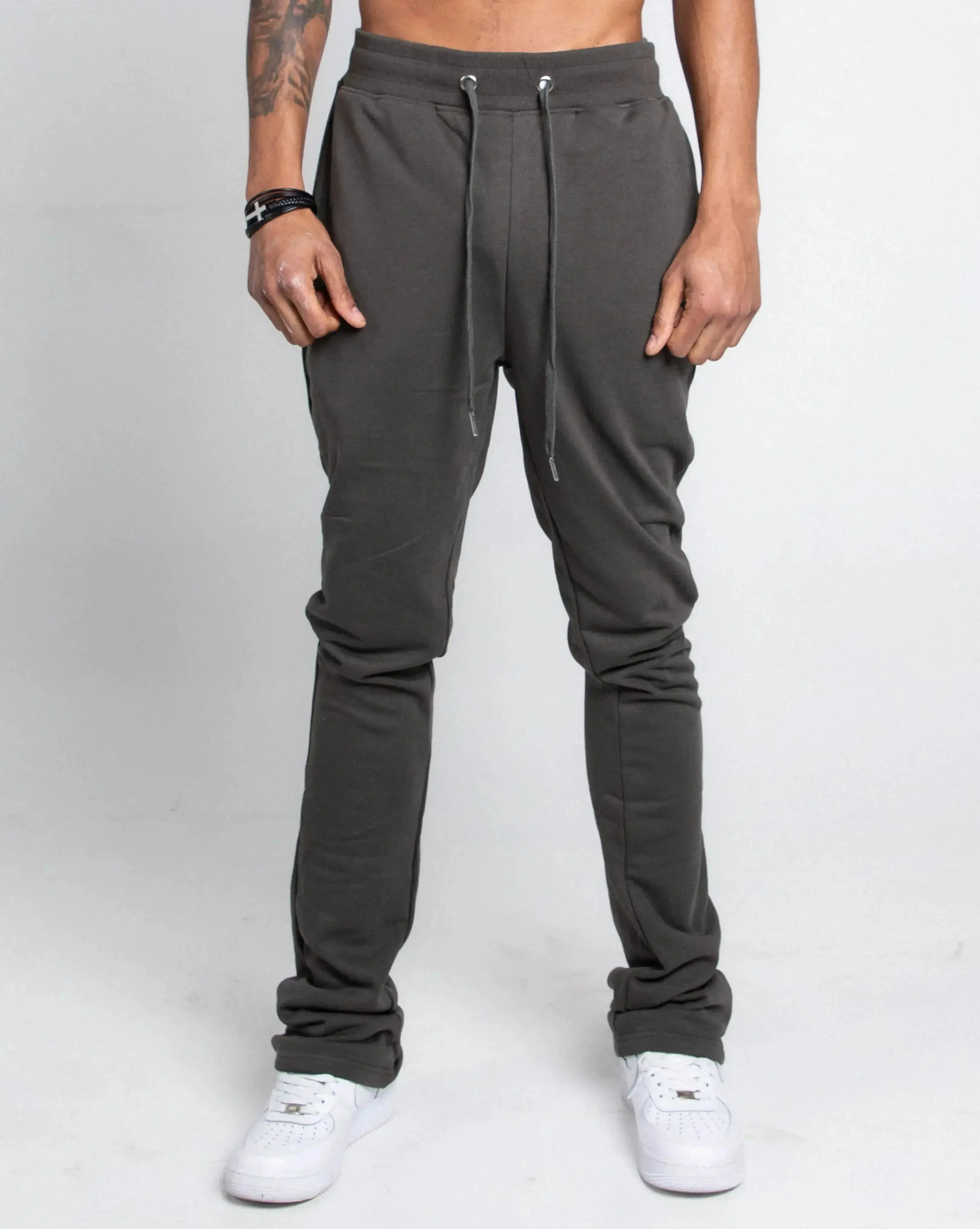Multi-color stacked sweatpants by Plush Fashion Hub, featuring a relaxed fit and vibrant, layered design, shown on a model.