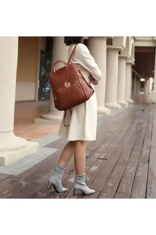 Plush Fashion Hub Mia signature vegan leather backpack with gold-tone hardware, stylish and trendy for everyday use.