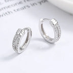 925 silver knot diamond earrings with a stylish, unique design featuring sparkling diamonds and intricate silver craftsmanship.