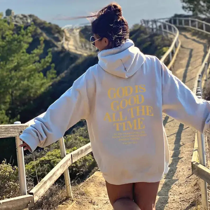Unisex brushed drawstring hoodie with letter print from Plush Fashion Hub, urban streetwear style, worn by a man and woman.