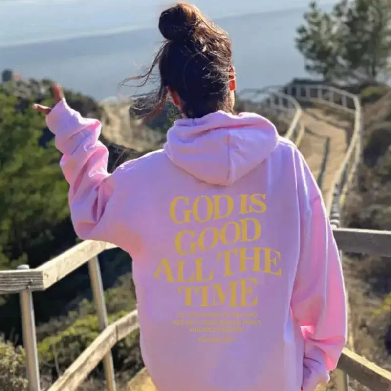 Unisex brushed drawstring hoodie with letter print in urban streetwear style by Plush Fashion Hub, worn by a man and woman.