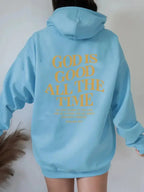 Unisex brushed hoodie with letter print and drawstring, urban streetwear style by Plush Fashion Hub, worn by a man and woman.