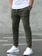 Men's slim fit casual drawstring trousers from Plush Fashion Hub, lightweight pants with pockets and a modern design.