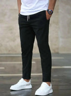 Men's slim fit casual drawstring trousers with pockets, lightweight pants from Plush Fashion Hub, suitable for everyday wear.