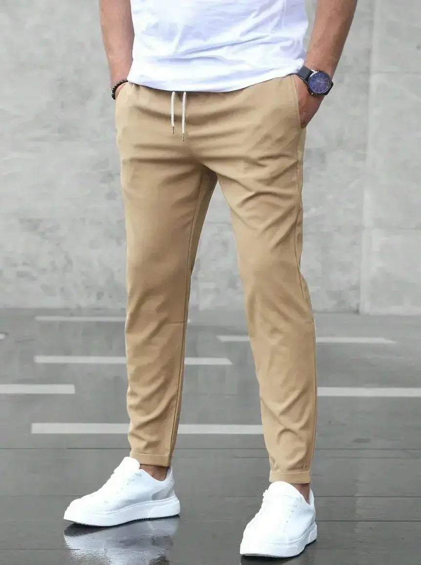 Men's slim fit casual drawstring trousers with pockets from Plush Fashion Hub, showing the stylish design and comfortable fit.