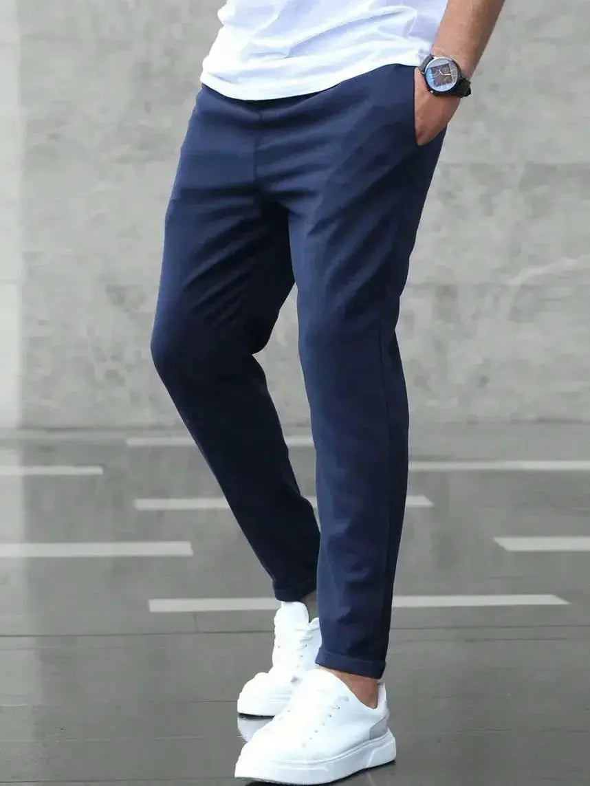 Men's slim fit casual drawstring trousers with pockets from Plush Fashion Hub, shown on a male model, versatile and comfortable style.