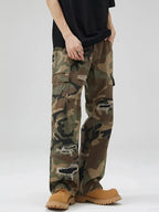 Men's distressed camouflage cargo pants by Plush Fashion Hub, rugged cotton streetwear with utility and stylish camo design.