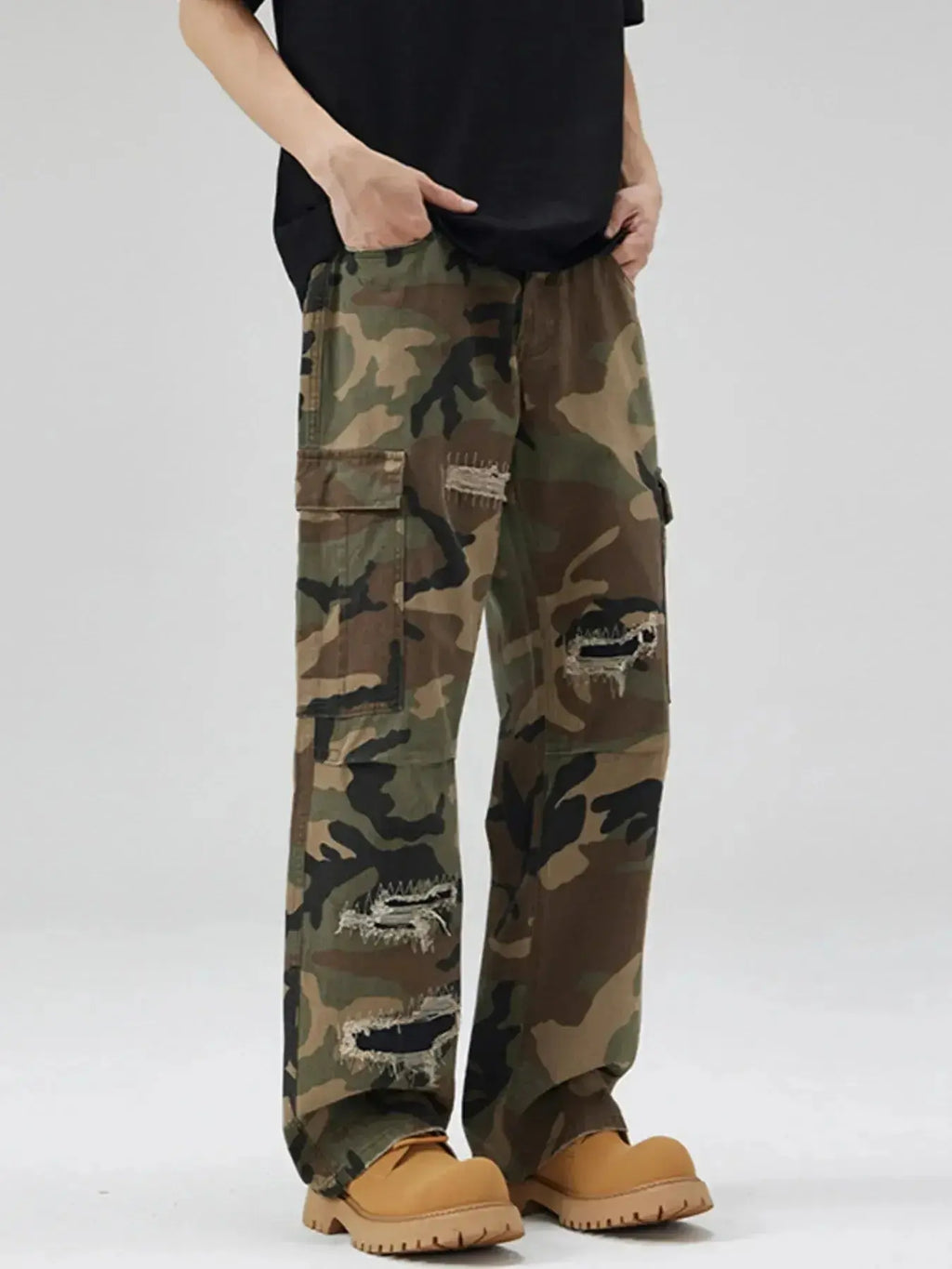 Men's distressed camouflage cargo pants by Plush Fashion Hub, rugged cotton streetwear with utility design and tactical style.