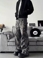 Men's relaxed fit camouflage print jeans showing urban casual streetwear style, denim fabric, and trendy camo pattern.