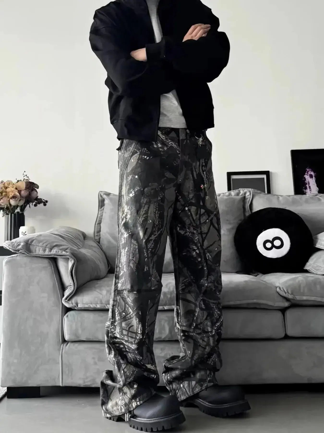 Men's relaxed fit camo print jeans with urban casual streetwear style, made of denim, featuring a comfortable fit and trendy camouflage pattern.