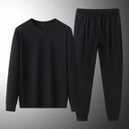 Men's plush fashion hub two-piece sweat suit with soft sweatshirt and jogger pants, ideal for spring and autumn lounge wear.