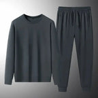 Men's plush fashion hub two-piece sweatshirt and jogger set, soft stretch lounge suit worn by a man in casual spring and autumn attire.