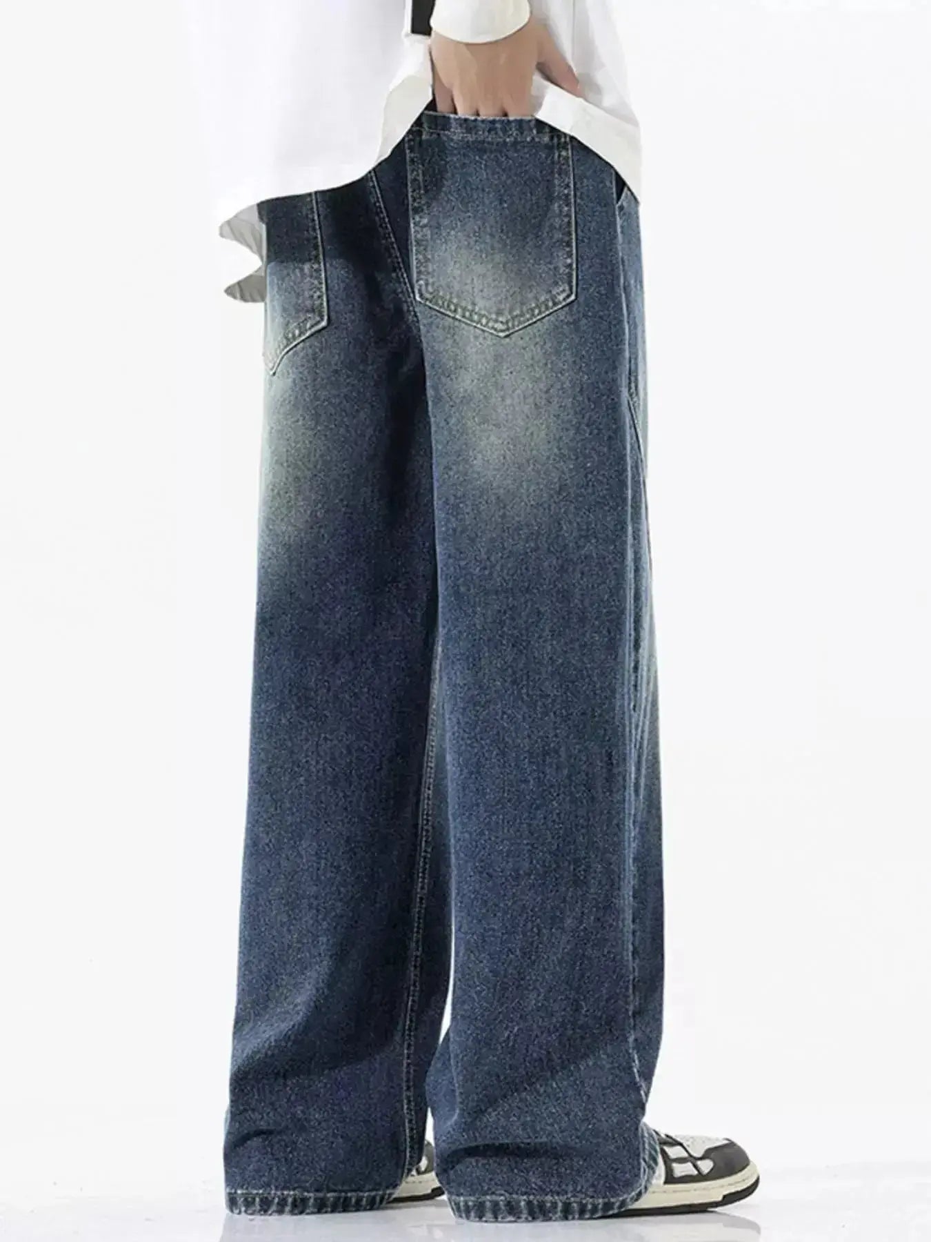 Men's vintage wash wide-leg drawstring jeans with relaxed fit cotton denim, featuring visible front pockets and a casual waistband.