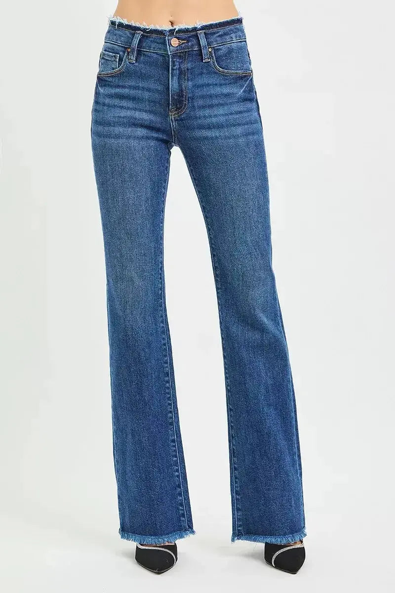 Plush Fashion Hub mid-rise bootcut jeans with frayed waist and raw hem detail, showcasing casual denim style.