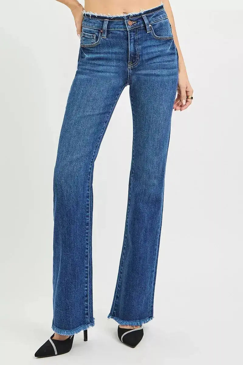 Plush Fashion Hub mid-rise bootcut jeans with frayed waist and raw hem detail, showcasing trendy denim style.