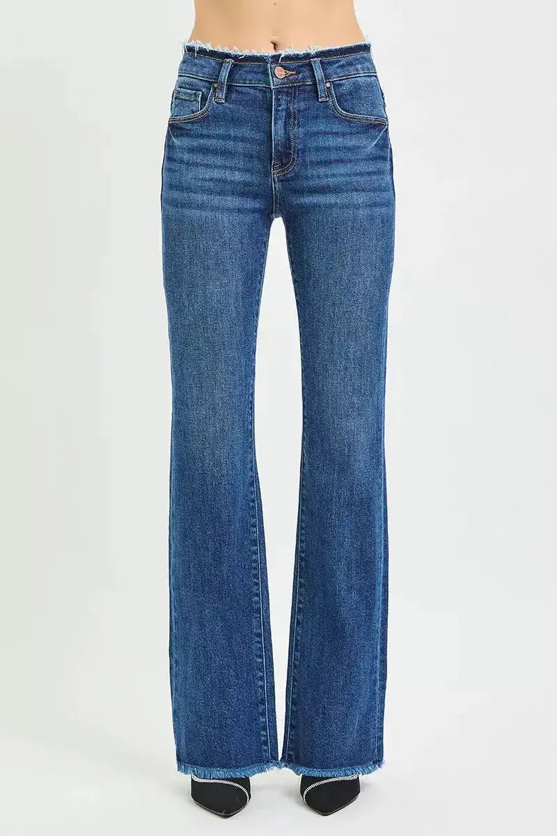 Plush Fashion Hub mid-rise bootcut jeans with frayed waist and raw hem detail, showcasing a casual denim style.