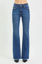 Plush Fashion Hub mid-rise bootcut jeans with frayed waist and raw hem detail, showcasing a casual denim style.