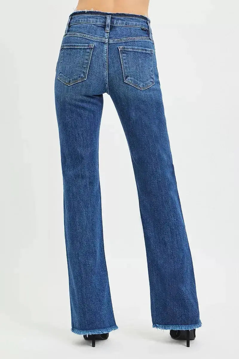 Plush Fashion Hub mid-rise bootcut jeans with frayed waist and raw hem detail, showcasing casual denim style.