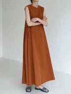 Plush Fashion Hub sleeveless midi dress in solid color with breathable ramie cotton fabric and relaxed fit, minimalist style.