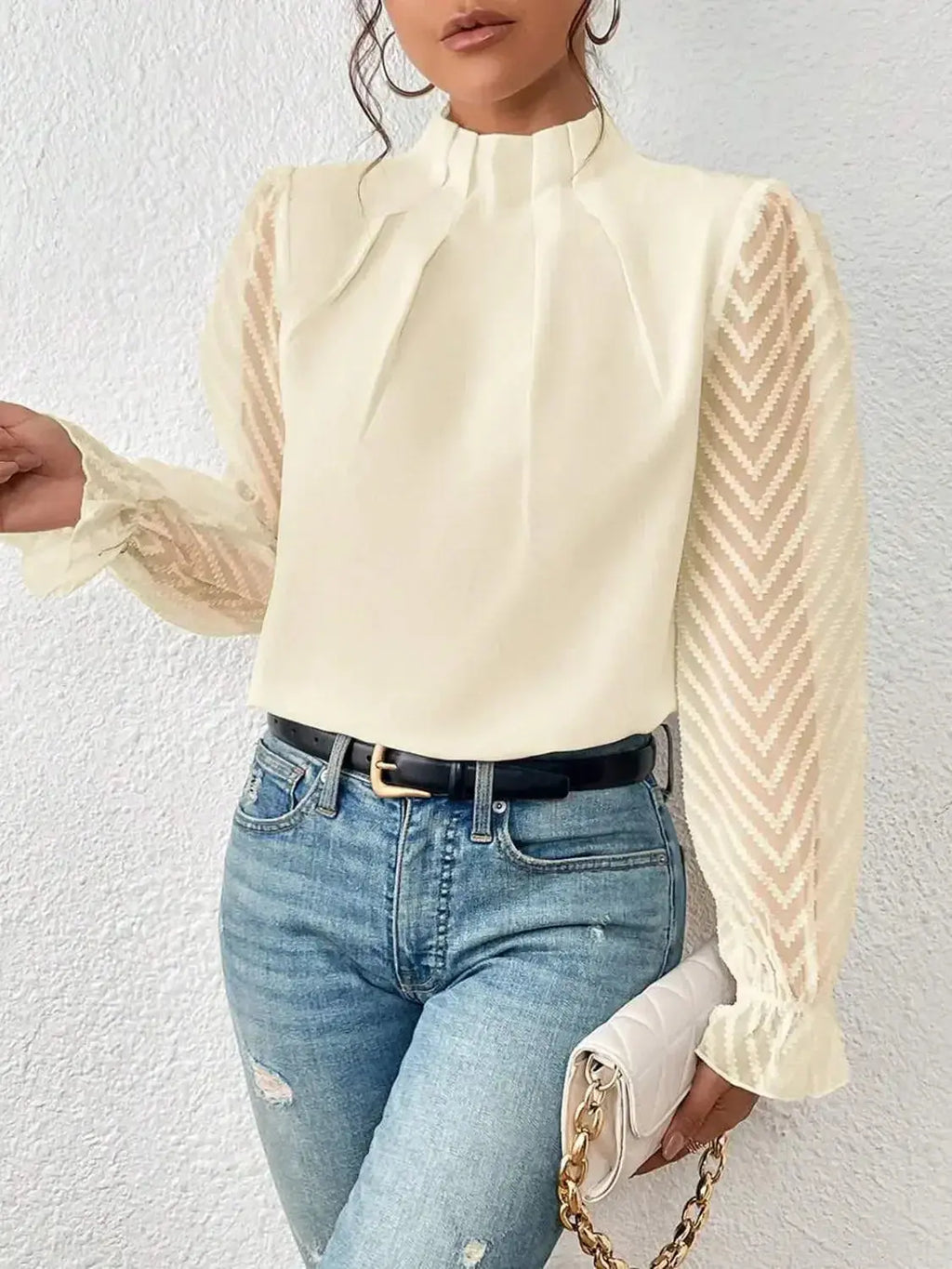 Elegant plush pink mock neck blouse with flounce sleeves, stylish shirt by Plush Fashion Hub displayed on a hanger.