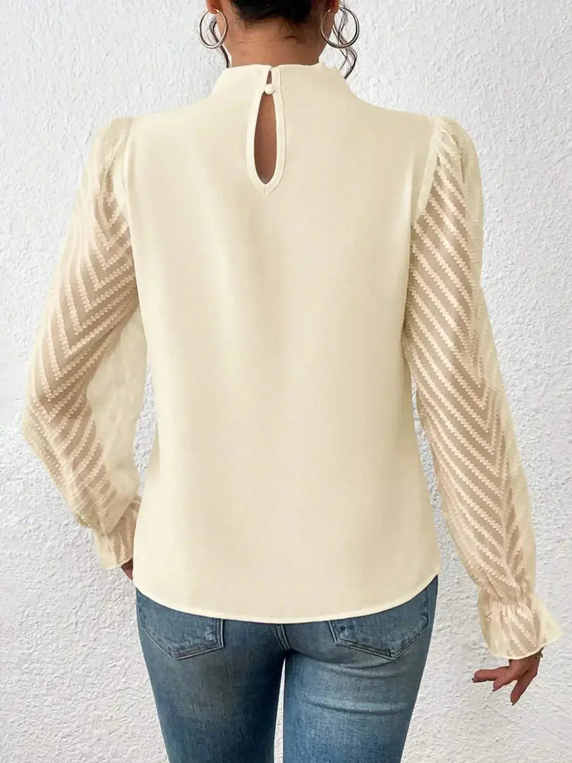 Elegant plush pink mock neck blouse with flounce sleeves, stylish shirt by Plush Fashion Hub displayed on a mannequin.