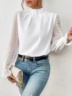 Elegant plush fabric mock neck blouse with flounce sleeves from Plush Fashion Hub, shown in a stylish close-up view.