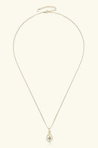 Moissanite 0.3ct necklace in sterling silver with 18K gold accents, showcasing a delicate jewelry design.