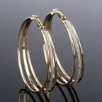 Modern multilayer forked circle earrings in gold and silver from Plush Fashion Hub, showcasing layered geometric design.