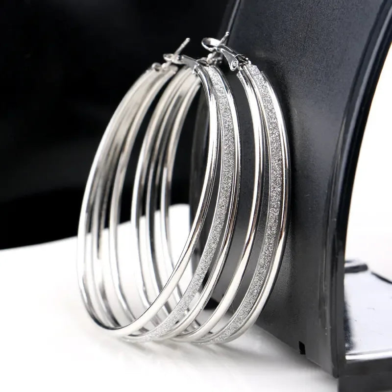 Modern multilayer forked circle earrings in two-tone gold and silver with a stylish design by Plush Fashion Hub.