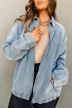 Blue denim jacket with zip-up front, raglan sleeves, and elastic hem from Gilded Glamour Shop, showcasing casual outerwear style.