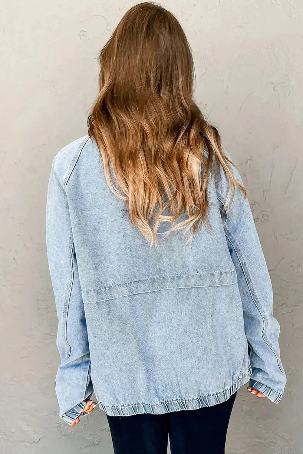 Myosotis zip-up denim jacket with raglan sleeves and elastic hem, stylish Gilded Glamour Shop jacket on a model.
