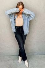 Myosotis zip-up denim jacket by Gilded Glamour Shop featuring raglan sleeves and an elastic hem, displayed on a hanger.