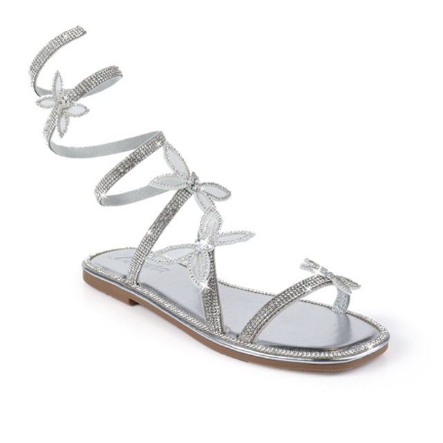 Silver Nancy-1 sandals from The House of Stylez showing side view with open toes and ankle straps on a neutral background.