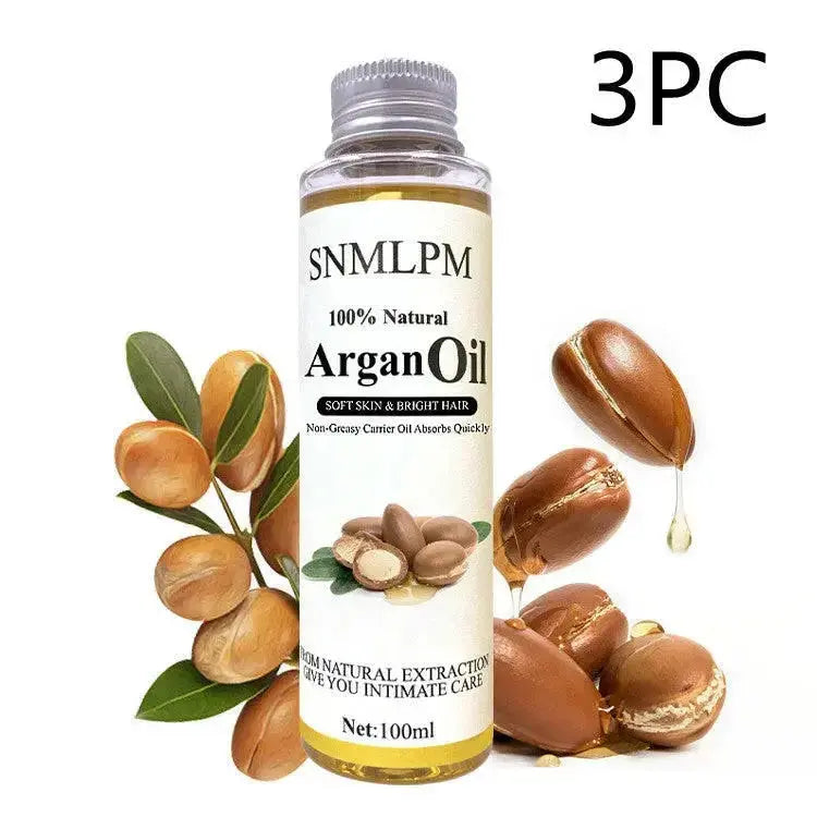 Plush Fashion Hub natural argan hair oil bottle for deep hydration and frizz control, 100ml, high-quality hair treatment product.