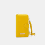 Convertible vegan leather crossbody phone case and wallet by Plush Fashion Hub, showcasing a sleek, stylish design with multiple compartments.