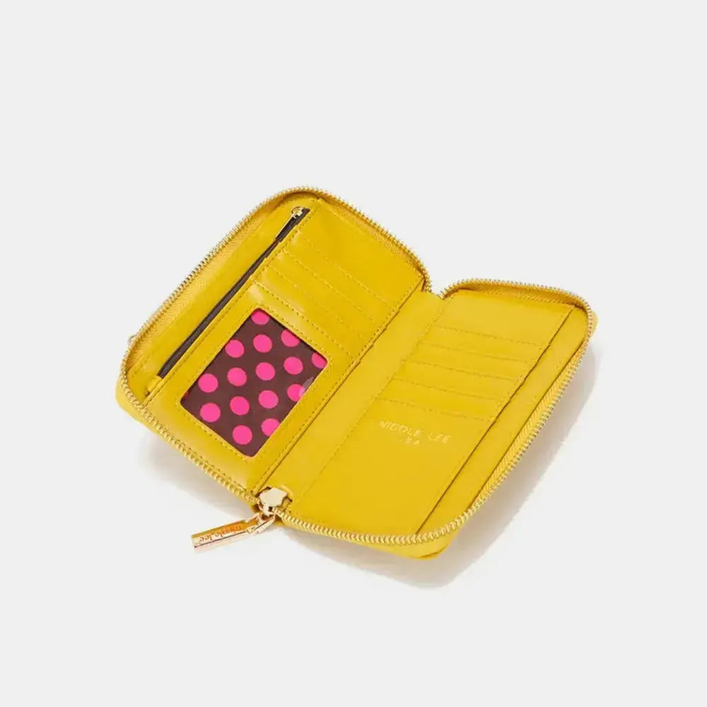Convertible vegan leather crossbody phone case and wallet by Plush Fashion Hub, featuring multiple compartments and stylish design.