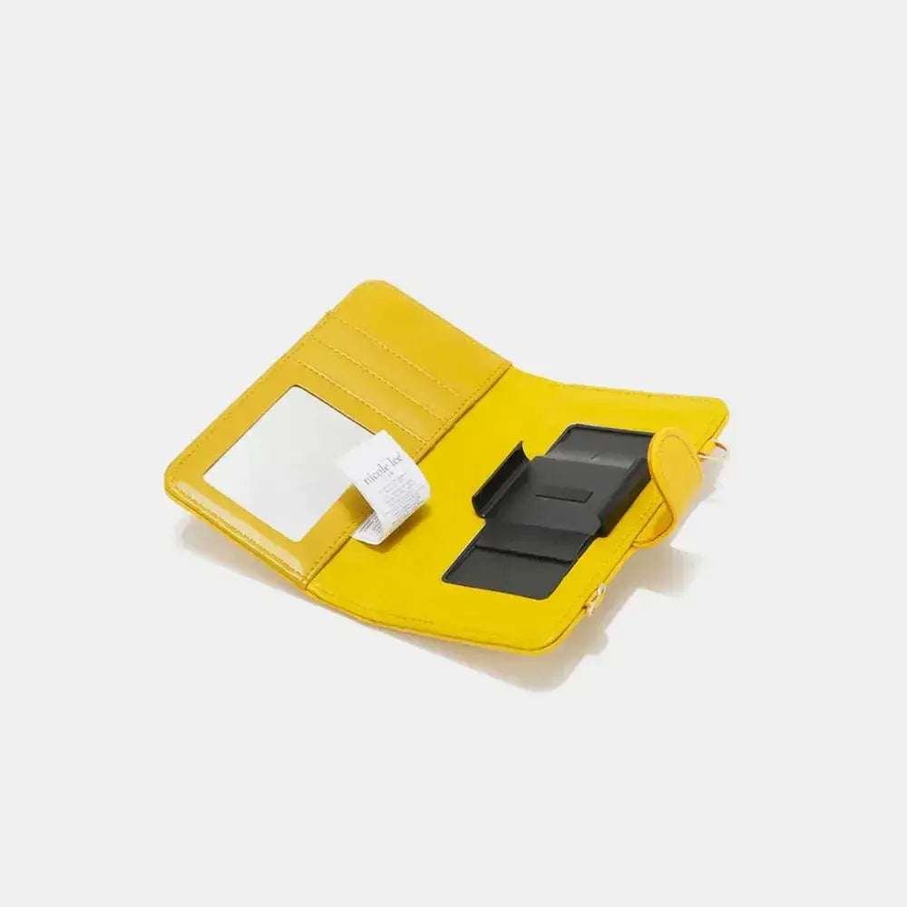 Convertible vegan leather crossbody phone case and wallet by Plush Fashion Hub, featuring a sleek design and multiple compartments.