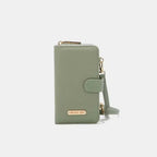 Convertible vegan leather crossbody phone case and wallet by Plush Fashion Hub, featuring sleek design and multiple compartments.