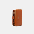 Convertible vegan leather crossbody phone case and wallet by Plush Fashion Hub, featuring a stylish design and functional compartments.