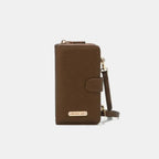 Convertible vegan leather crossbody phone case and wallet by Plush Fashion Hub, featuring a compact design with multiple compartments.