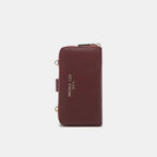 Convertible vegan leather crossbody phone case and wallet by Plush Fashion Hub, featuring a sleek design and multiple compartments.