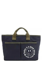 Artistic graphic print canvas tote bag by Plush Fashion Hub, spacious casual handbag with vibrant design and sturdy handles.