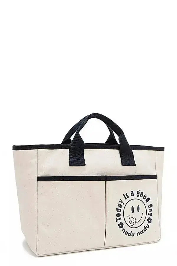 Artistic graphic print canvas tote bag by Plush Fashion Hub, spacious casual handbag with stylish design and durable handles.