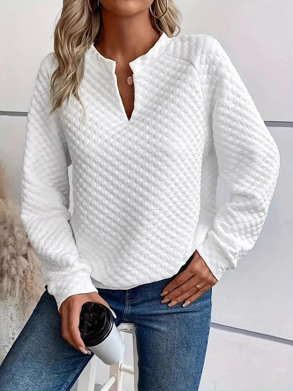 Women's plush fashion raglan waffle-knit sweatshirt with notched sleeves, soft textured pullover for casual comfort.